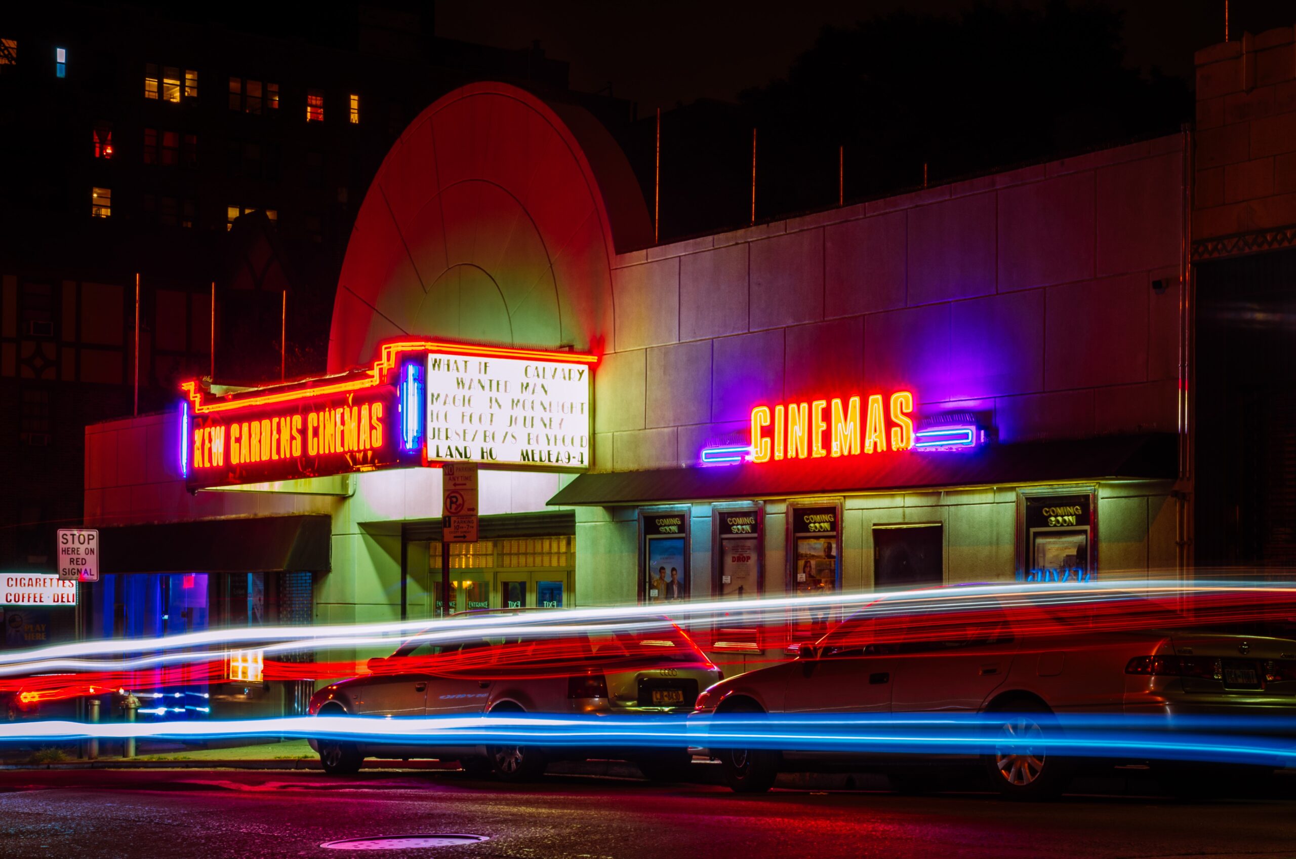 11movie-theater-at-night-with-neon-signs