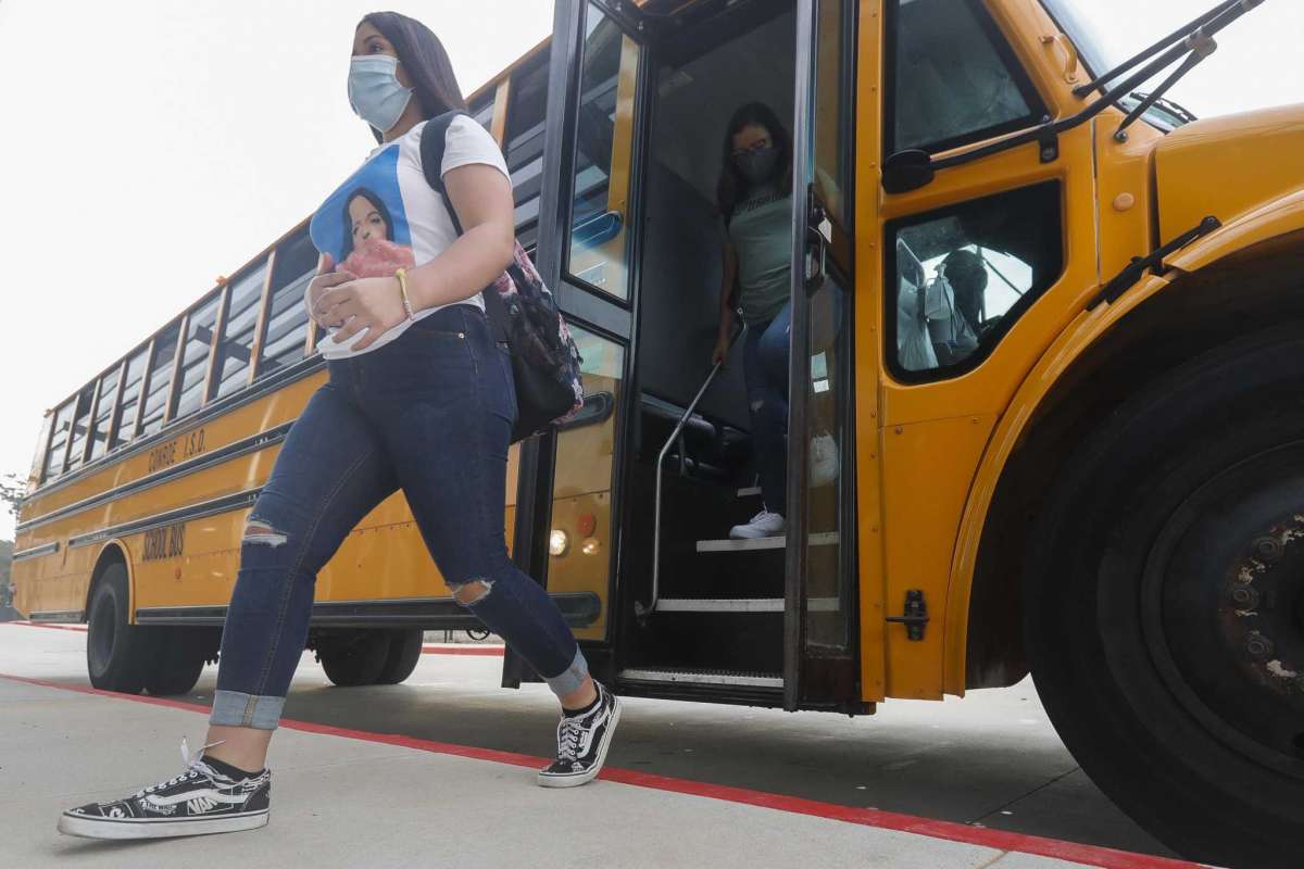 Students getting off of school bus